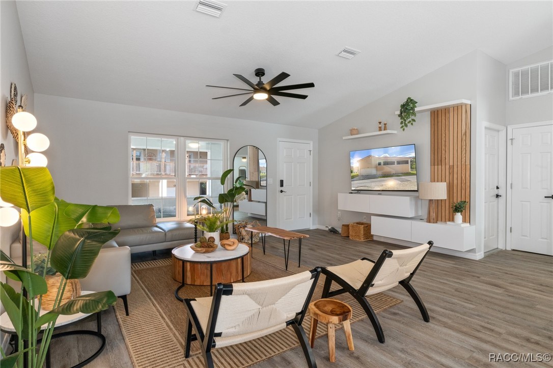 4865 South Tromp Loop Homosassa, FL 34448 - Photo 2 of 30 a view of a dining room with furniture window and wooden floor