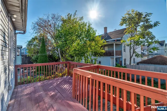 a view of a chair and tables in the backyard