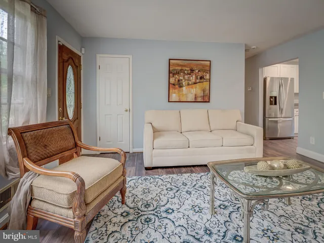 a living room with furniture and a rug