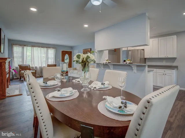 a kitchen with a dining table and chairs