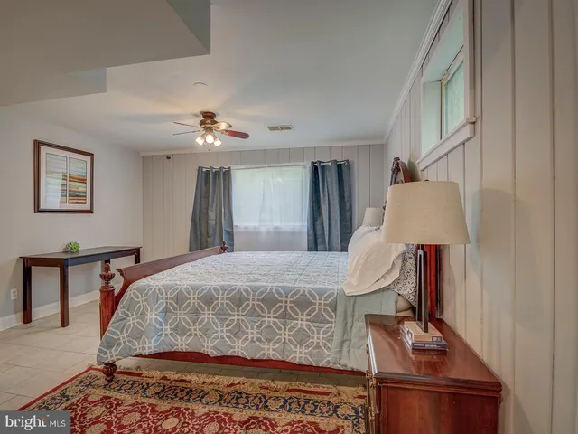 a bed room with a bed and a lamp