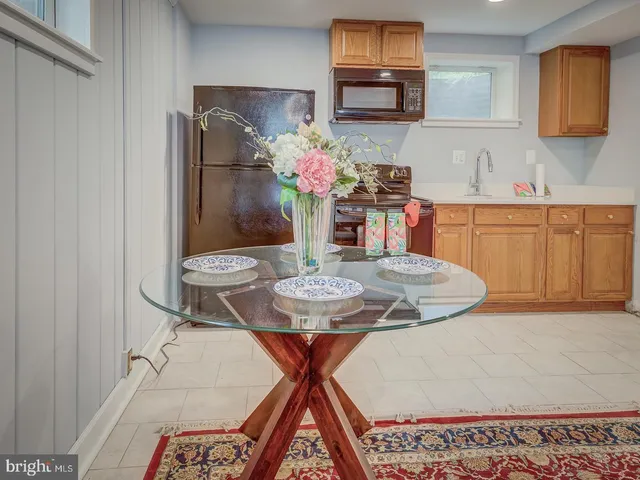 a dining room with furniture and chandelier