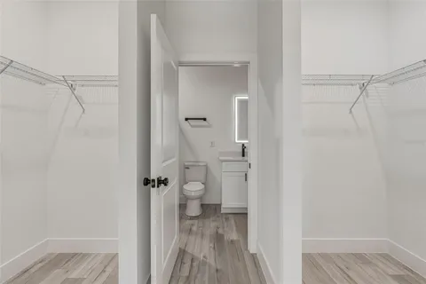 a view of a bathroom from a hallway