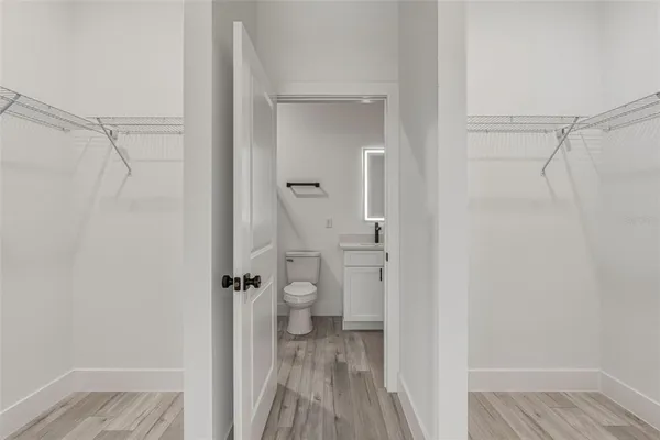 a view of a bathroom from a hallway