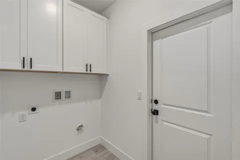 a view of cabinets and wooden floor