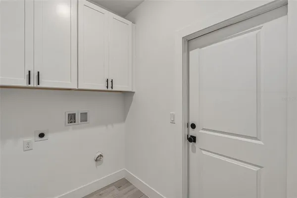 a view of cabinets and wooden floor