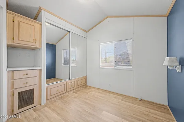 a view of cabinets and wooden floor