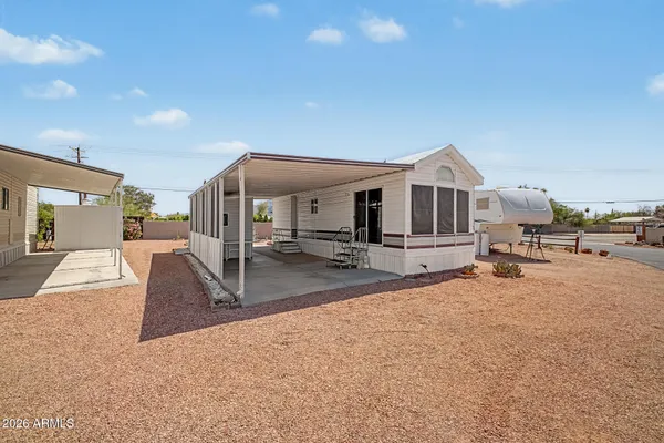 a view of a house with kitchen and a patio