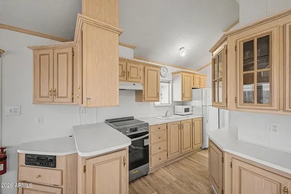 a kitchen with stainless steel appliances granite countertop a stove and a sink