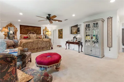 a living room with furniture a dining table and a fireplace
