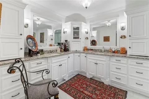 a spacious bathroom with a double vanity sink mirror and