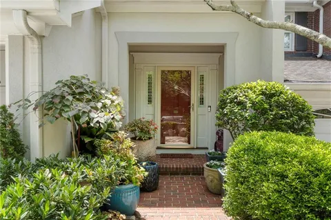 front view of a house with a potted plant