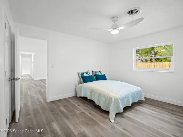 a bedroom with a bed and a table