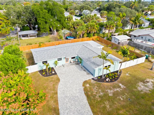 an aerial view of a house with swimming pool