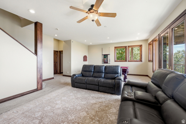 335 Bern Way Midway, UT 84049 - Photo 42 of 88 Spacious entertainment area featuring recessed lighting, a ceiling fan, and multiple large windows