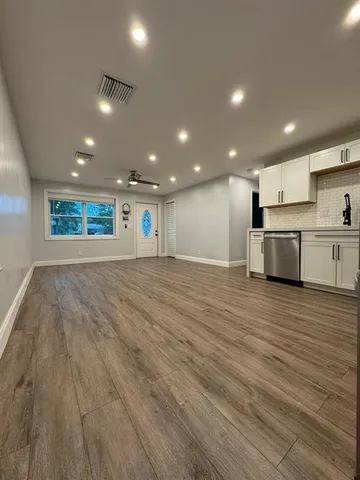 a view of an empty room with a window