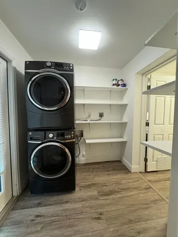 a view of a room with washing machine and dryer