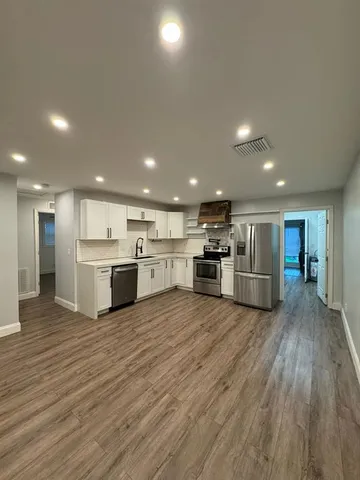 a view of kitchen with wooden floor