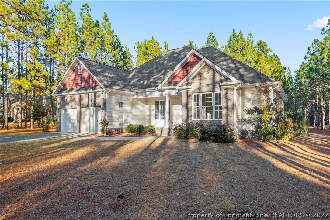 9078 Calloway Road Aberdeen, NC 28315 - Photo 3 of 27 a view of a house with a yard and pathway