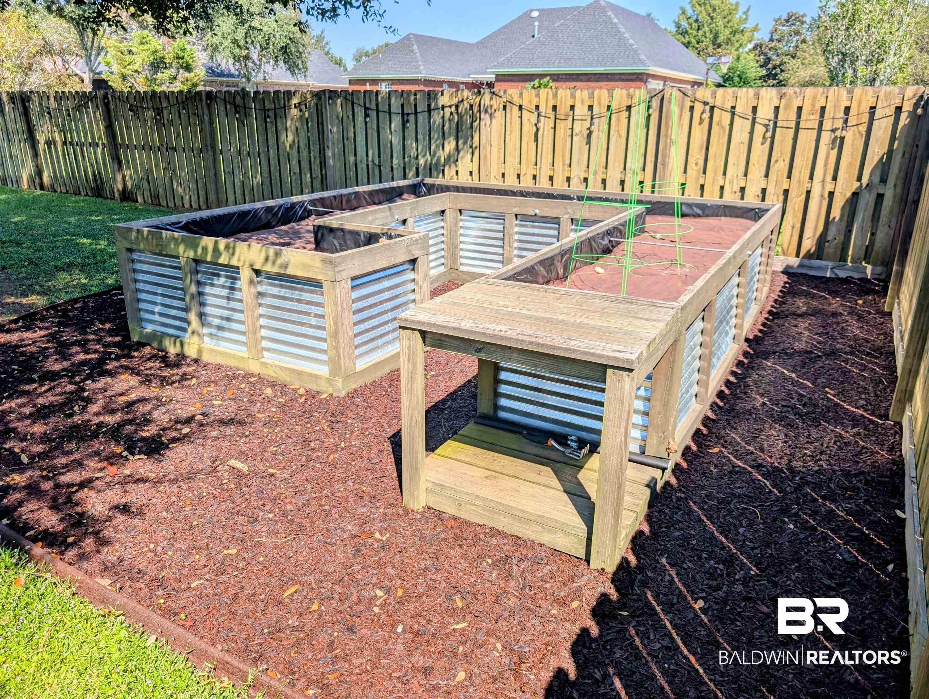 11623 Halcyon Loop Daphne, AL 36526 - Photo 70 of 90 The custom raised bed for gardeners ready for new plants. Fully plumbed to have access to water for you to create a custom irrigation system for your vegetables.
