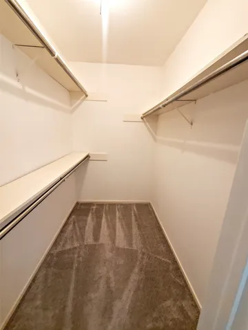 a view of an empty walk in closet