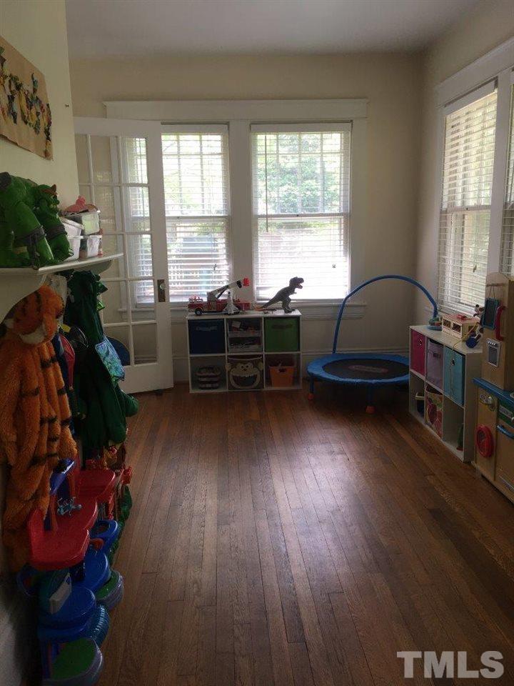 1425 Scales Street Raleigh, NC 27608 - Photo 13 of 25 a living room with furniture and a wooden floor