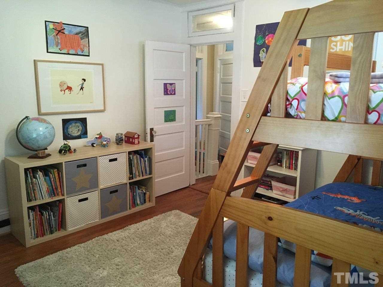 1425 Scales Street Raleigh, NC 27608 - Photo 16 of 25 a room with furniture and wooden floor