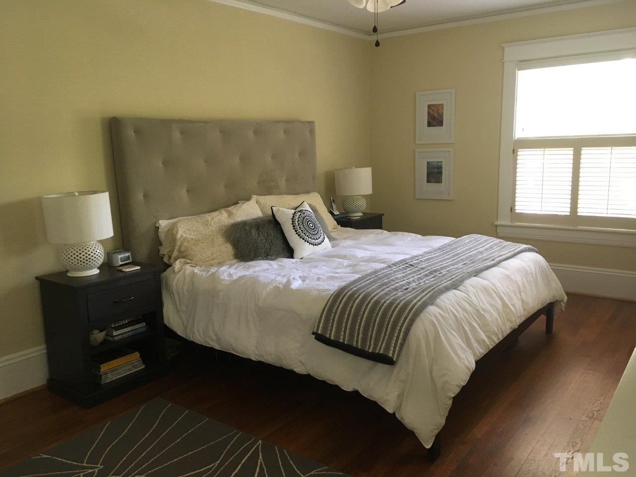 1425 Scales Street Raleigh, NC 27608 - Photo 18 of 25 a bedroom with a bed and window
