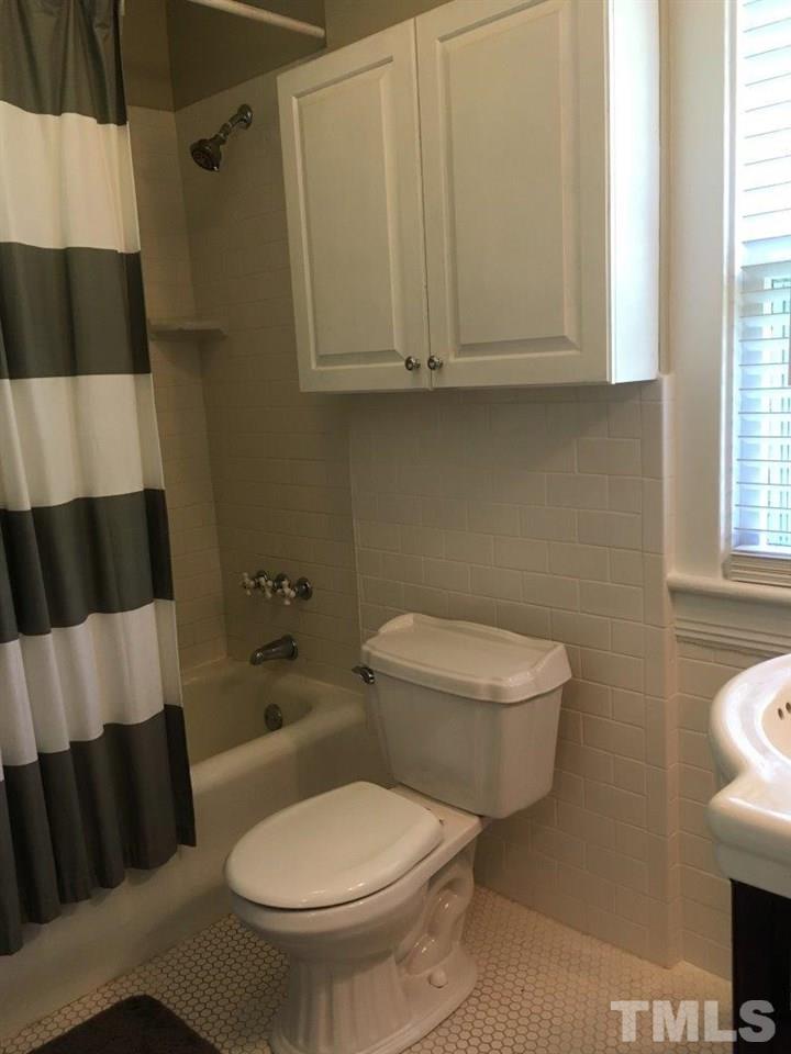 1425 Scales Street Raleigh, NC 27608 - Photo 21 of 25 a bathroom with a toilet and a shower