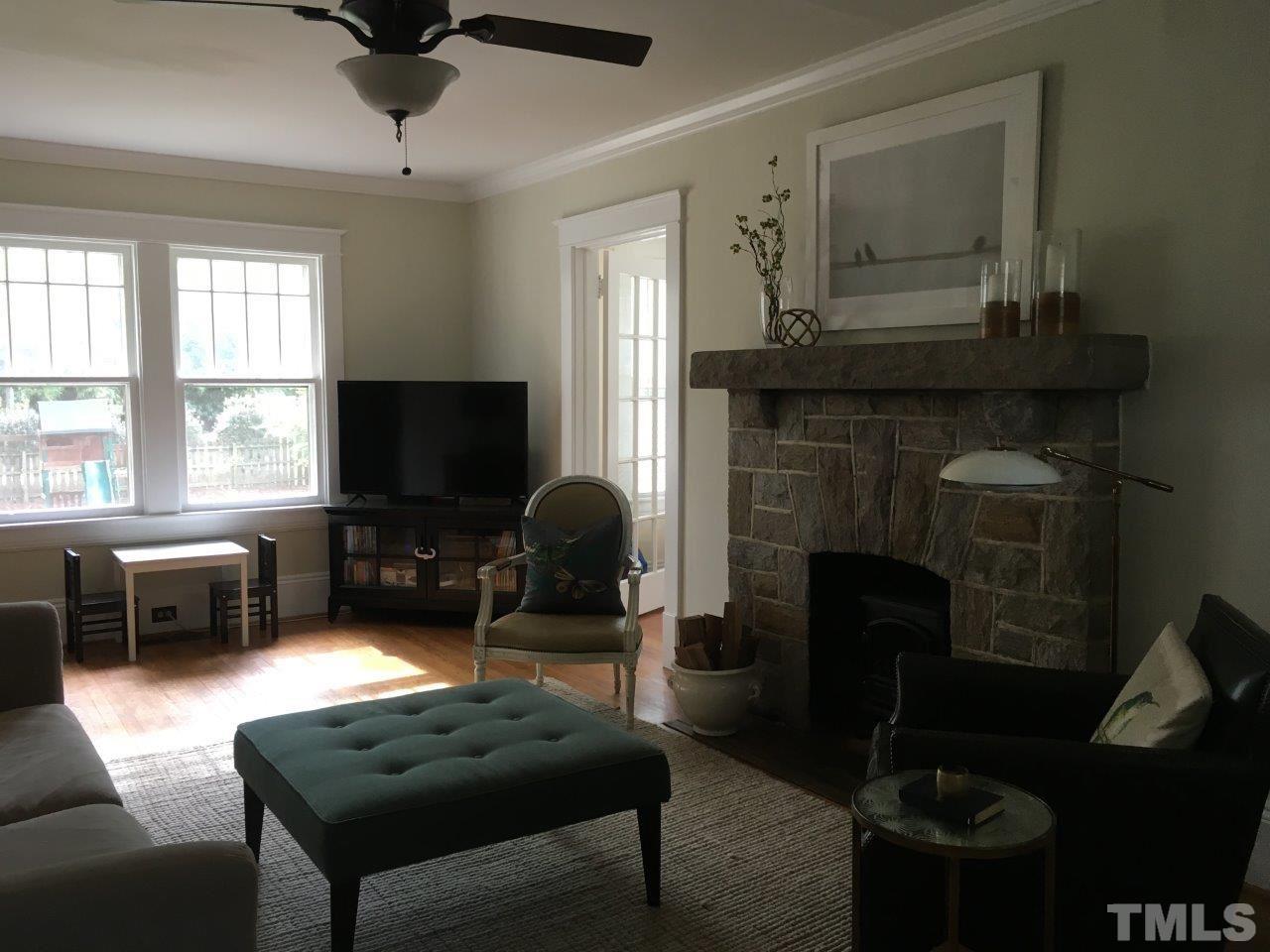 1425 Scales Street Raleigh, NC 27608 - Photo 4 of 25 a living room with furniture and a fireplace