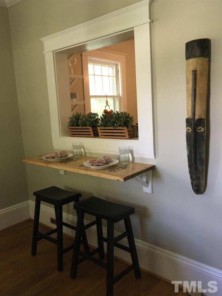 1425 Scales Street Raleigh, NC 27608 - Photo 8 of 25 a bathroom with a granite countertop sink and a mirror