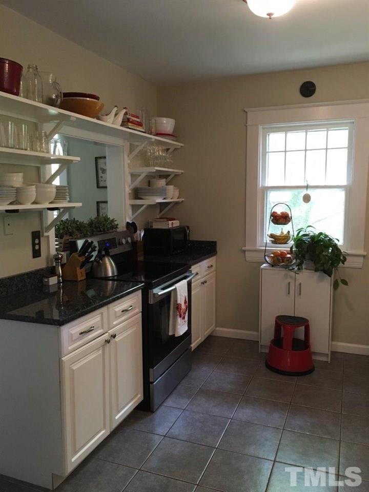 1425 Scales Street Raleigh, NC 27608 - Photo 9 of 25 a kitchen with a sink and cabinets