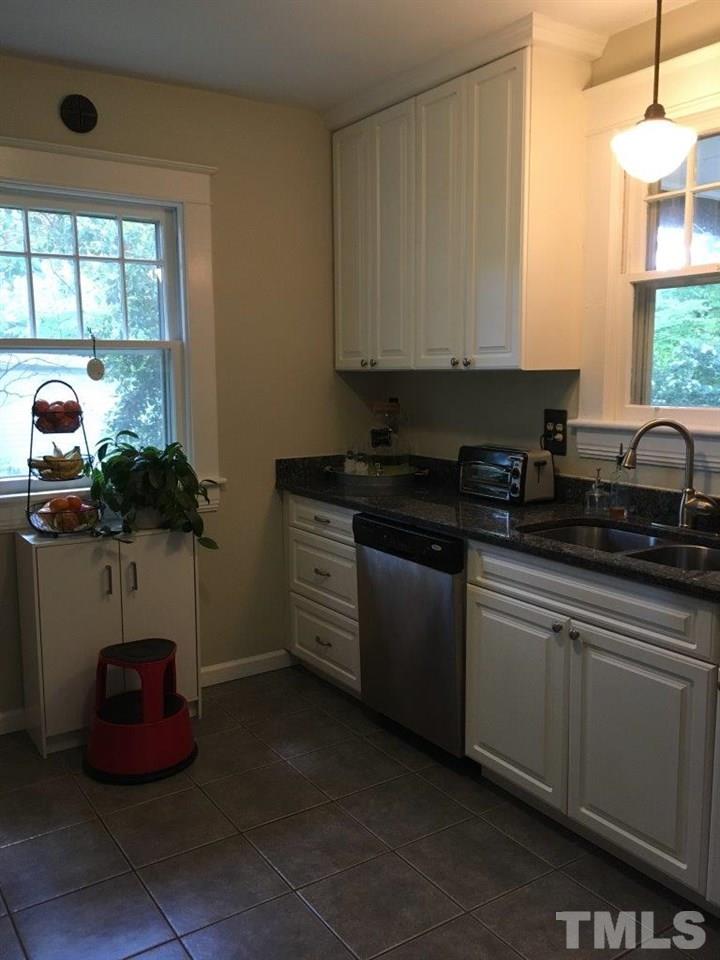 1425 Scales Street Raleigh, NC 27608 - Photo 10 of 25 a kitchen with a sink and cabinets