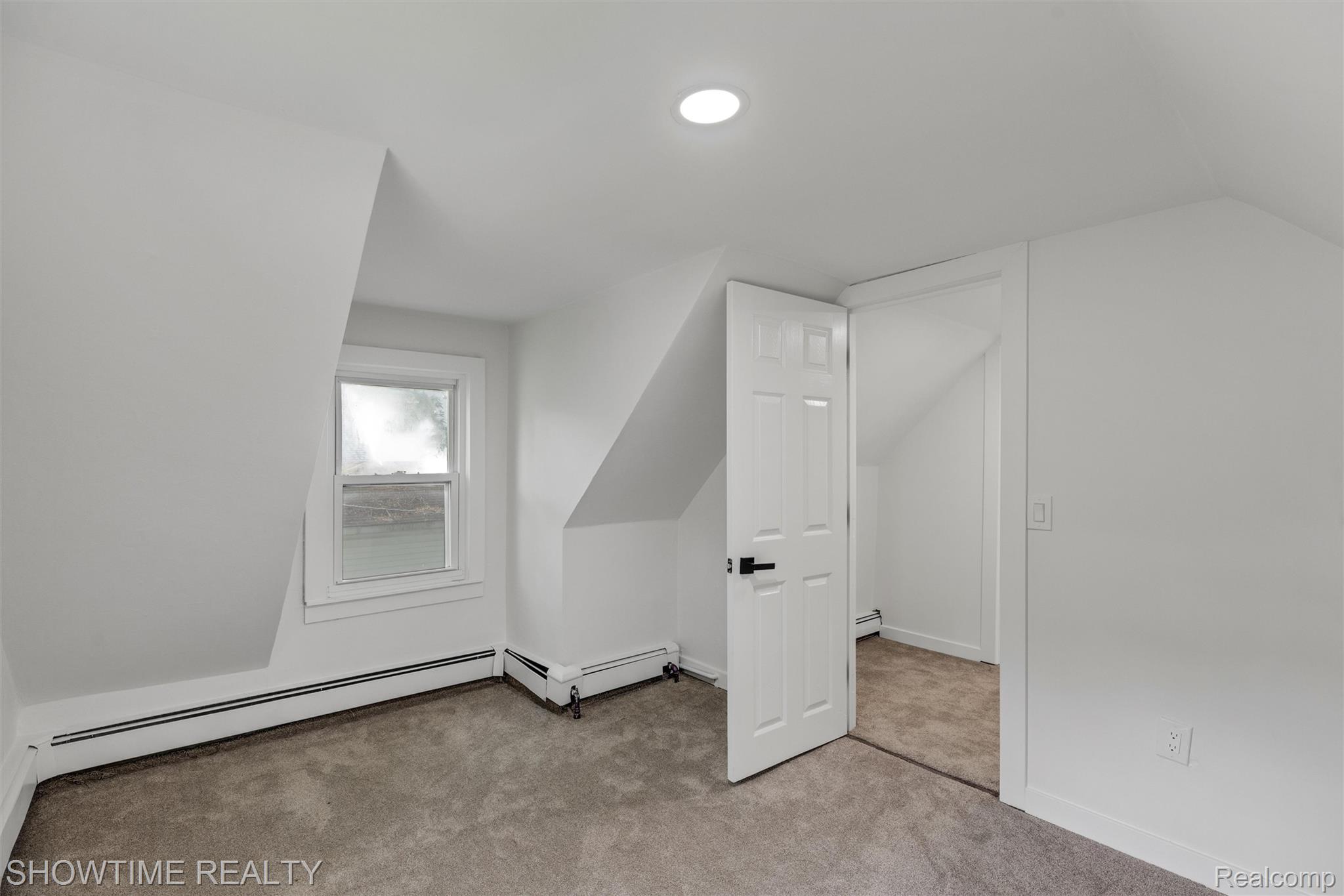 14854 East 10 Mile Road Warren, MI 48089 - Photo 18 of 24 Room featuring neutral-toned carpeting, white walls, and a recessed ceiling light