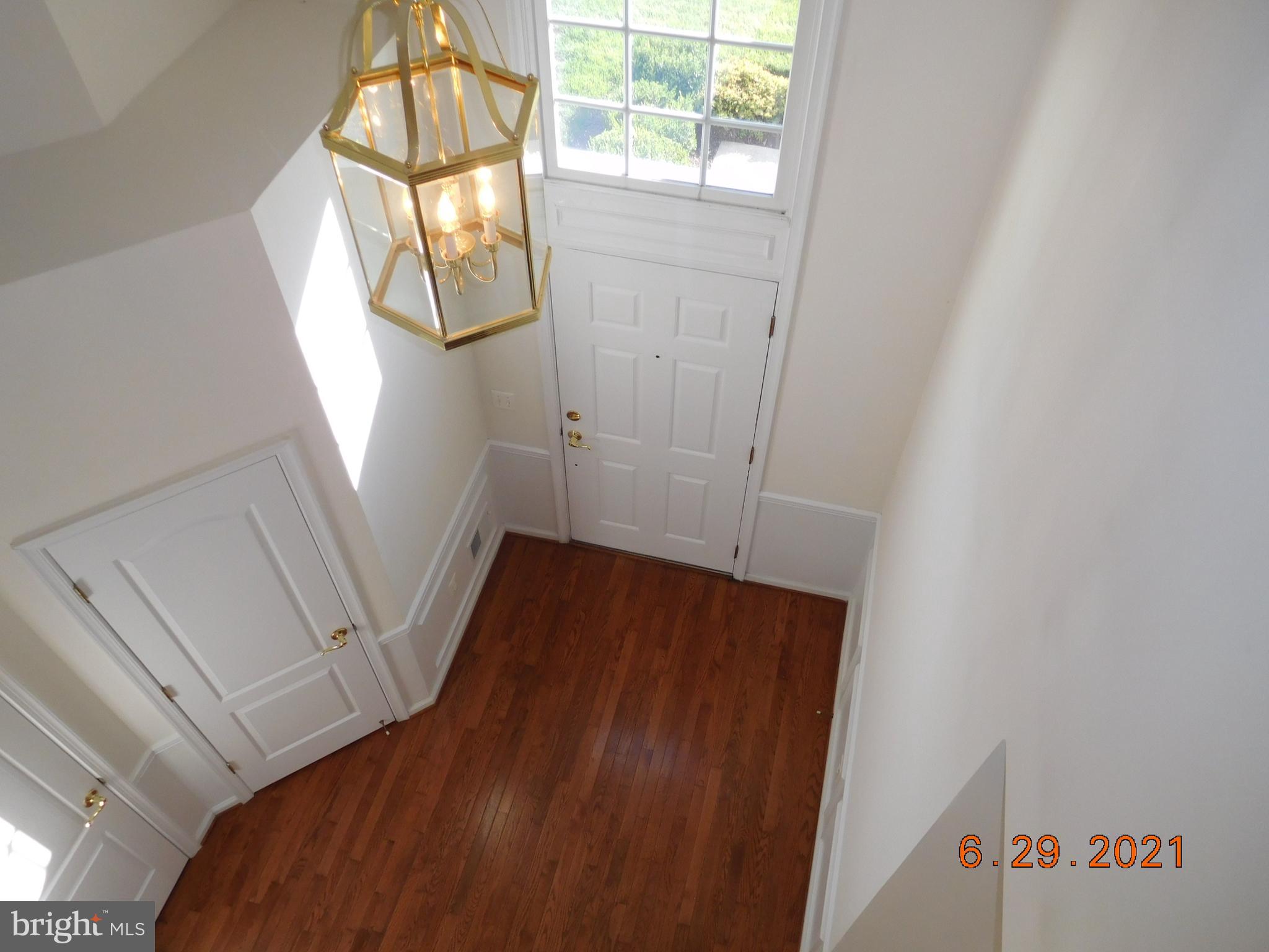 8246 Academy Road Ellicott City, MD 21043 - Photo 2 of 22 View from loft of foyer with hardwood