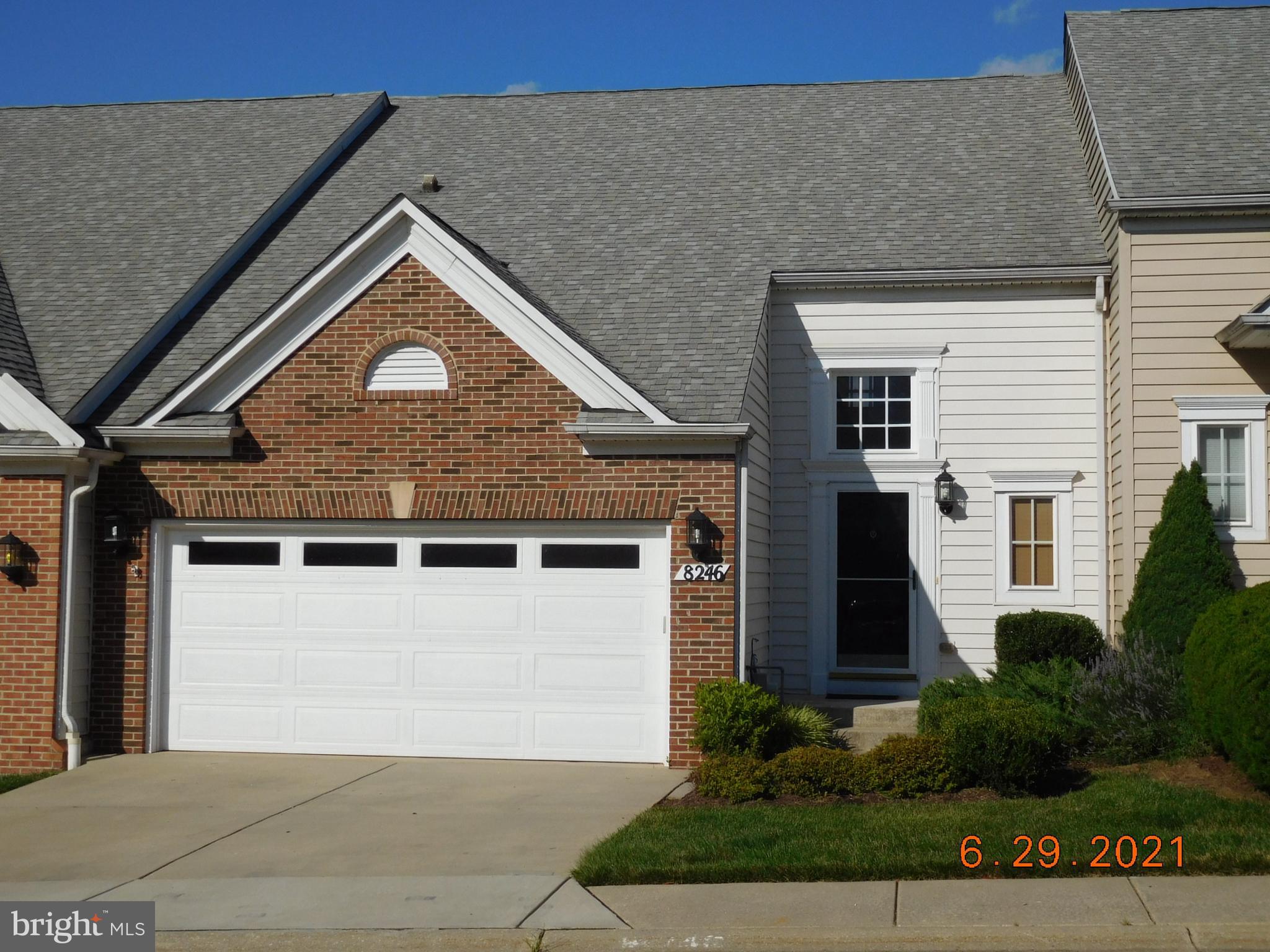 8246 Academy Road Ellicott City, MD 21043 - Photo 22 of 22 Front view of the villa showing brick and vinyl
