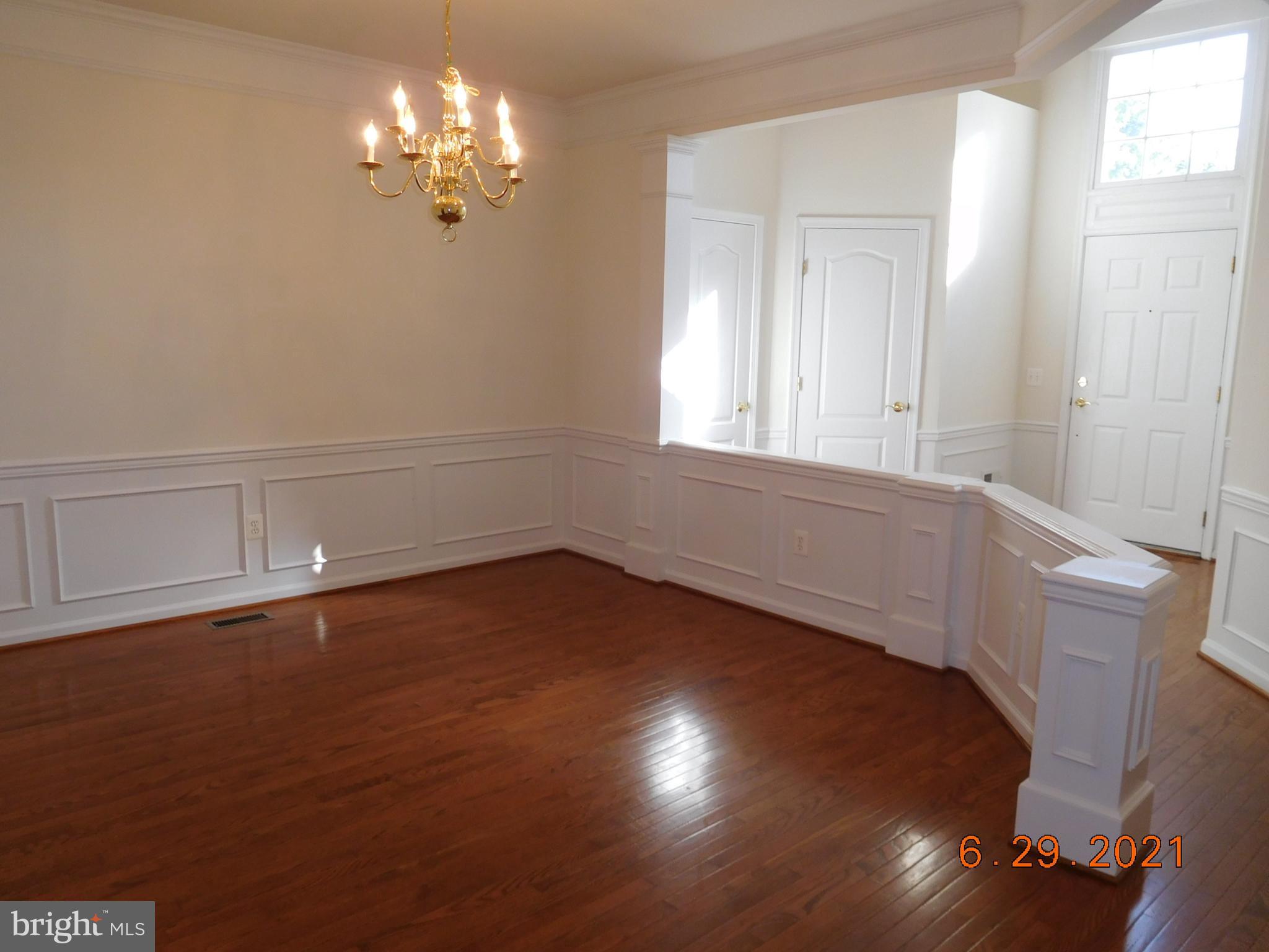 8246 Academy Road Ellicott City, MD 21043 - Photo 6 of 22 Formal dining room with hardwood flooring