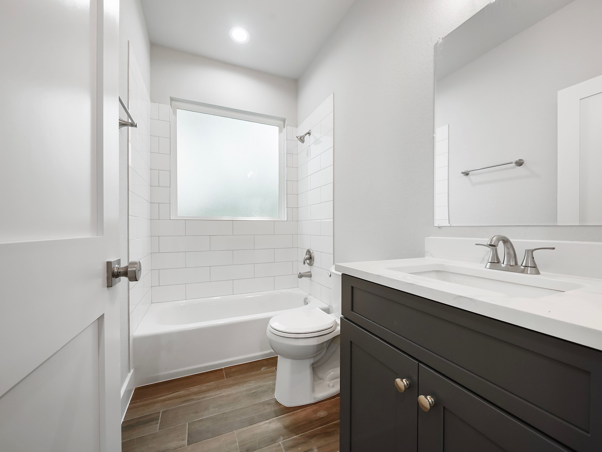 731 Magnolia Point Drive Houston, TX 77336 - Photo 27 of 36 Bathroom is mix of navy blue and white cabinets