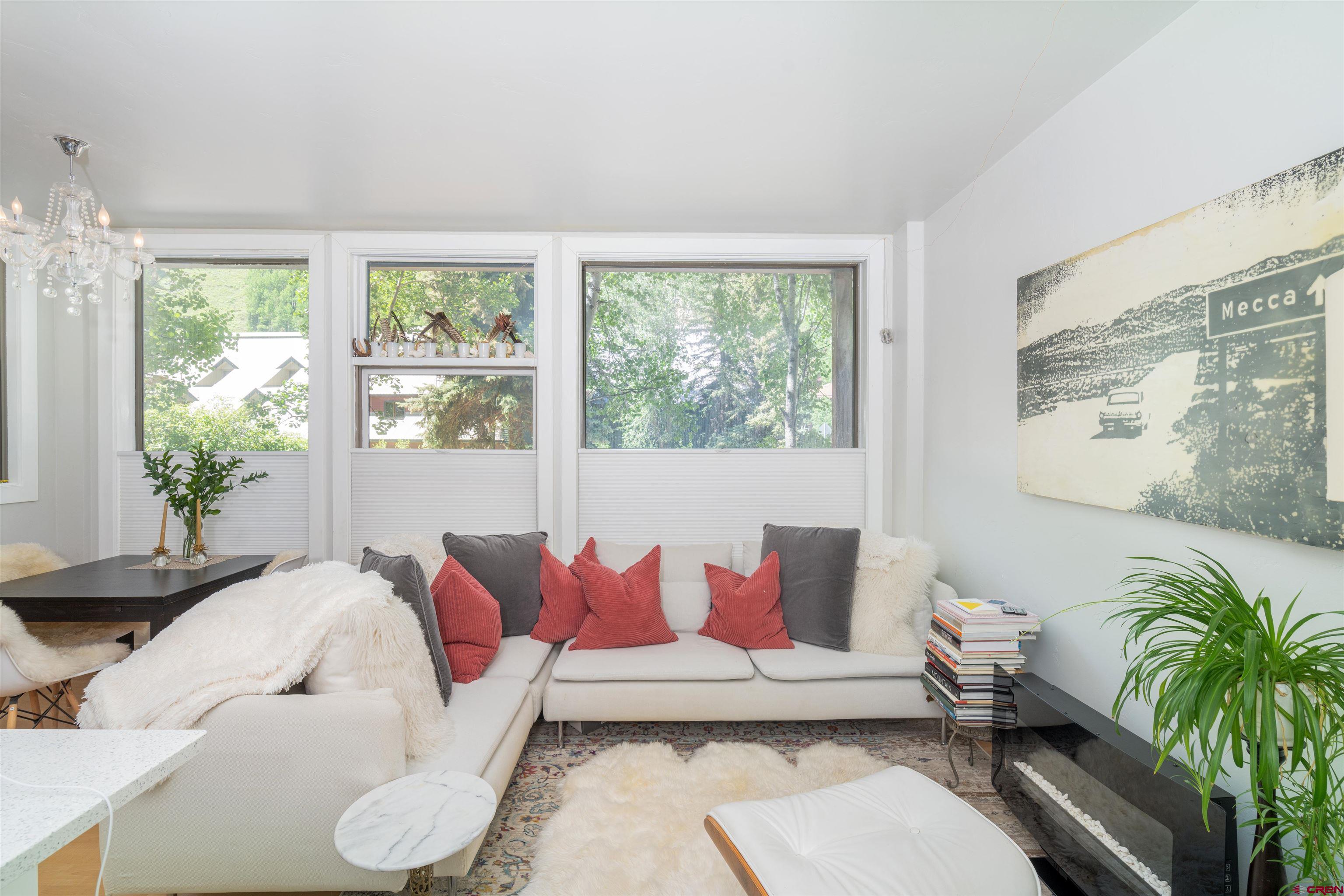 791 West Pacific Avenue, Unit 4H Telluride, CO 81435 - Photo 10 of 15 a living room with furniture and a large window