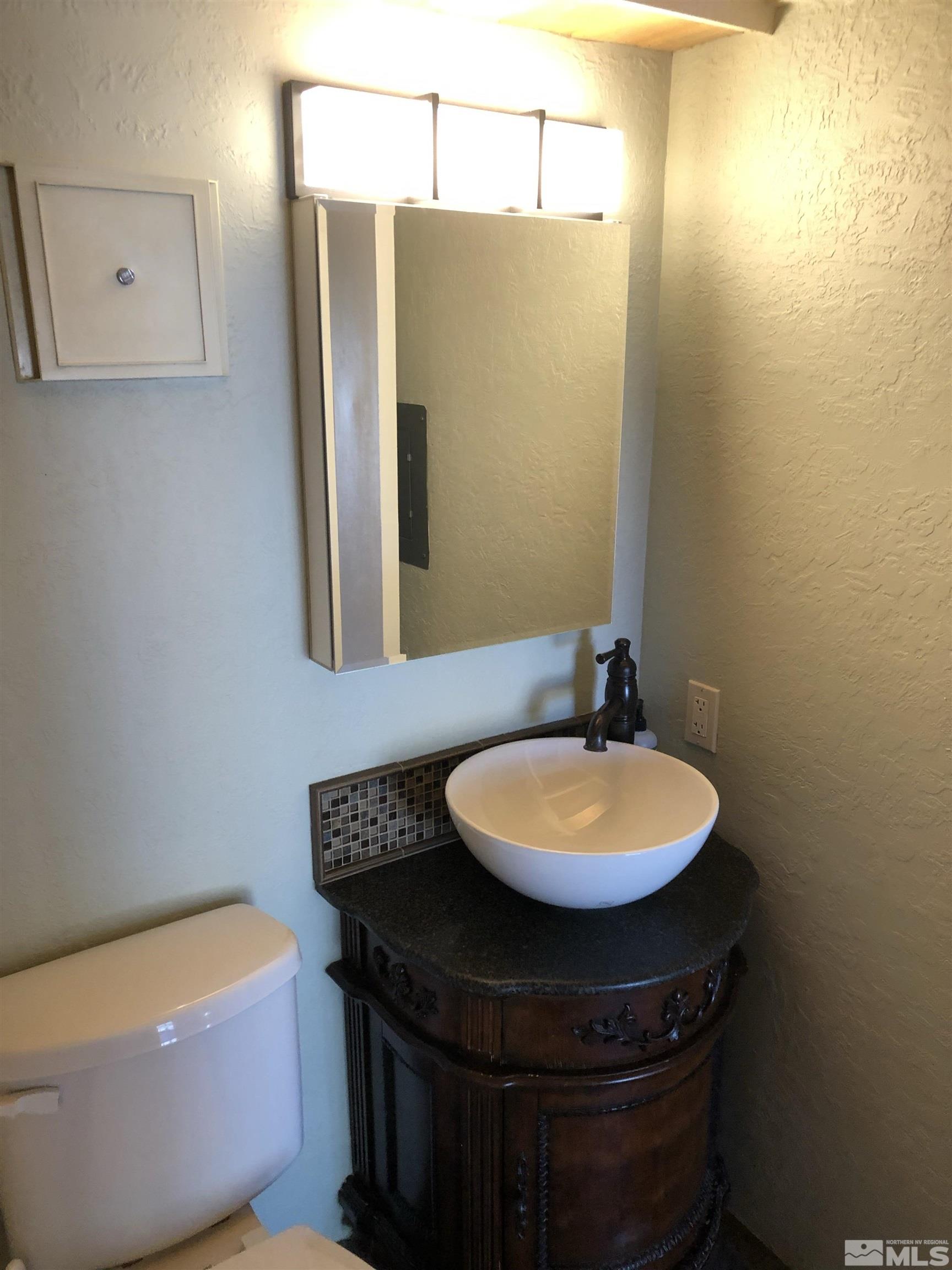 331 Tramway Drive, Unit 20 Stateline, NV 89449 - Photo 20 of 35 a bathroom with a sink and a mirror