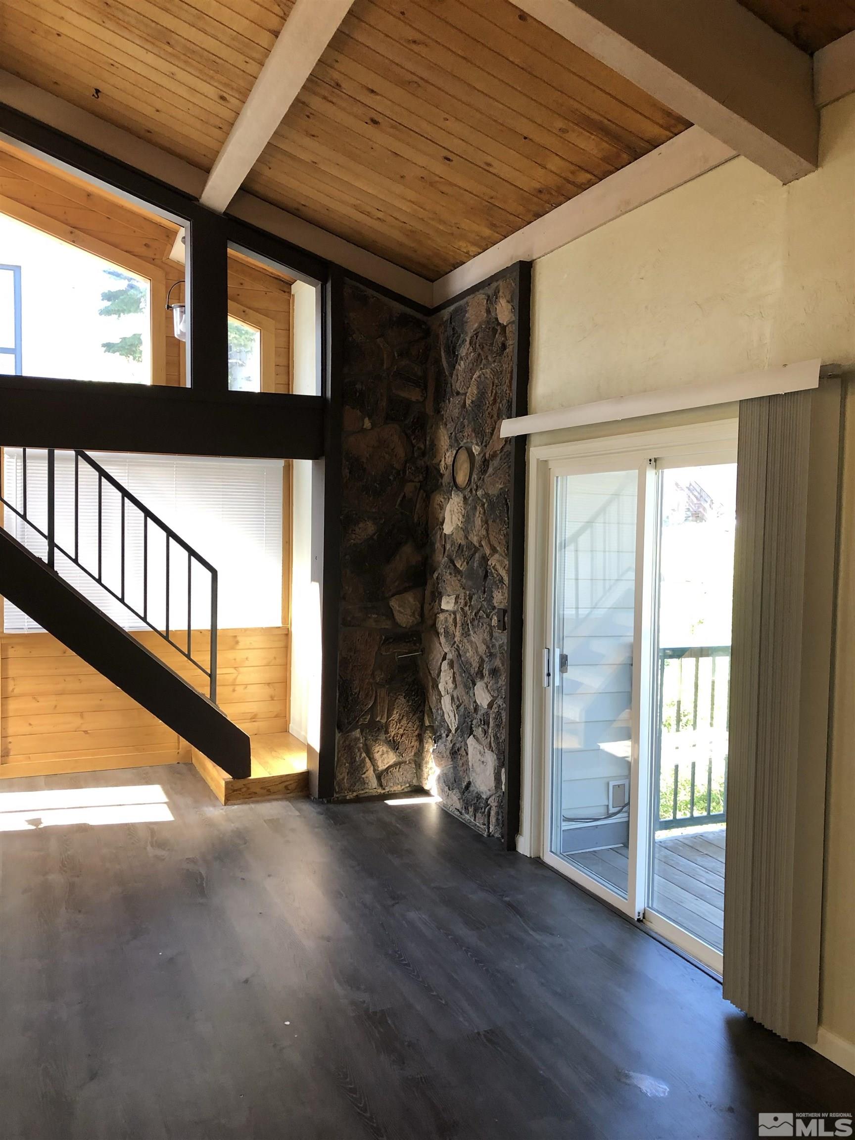 331 Tramway Drive, Unit 20 Stateline, NV 89449 - Photo 9 of 35 a view of a porch with wooden floor