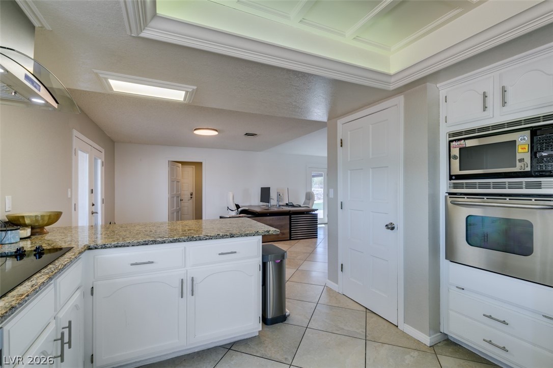 892 North Hollywood Boulevard Las Vegas, NV 89110 - Photo 10 of 81 This spacious kitchen offers ample counter space, modern appliances, and a seamless flow into adjacent living areas.
