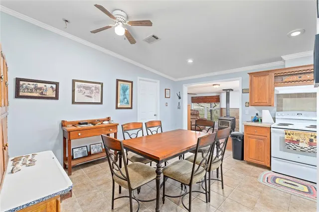 a dining room with a table and chairs