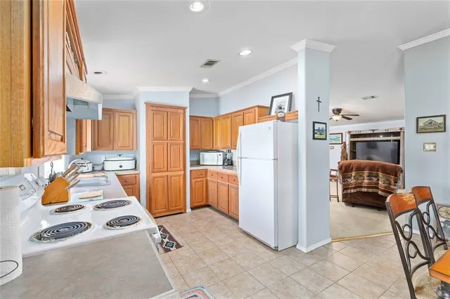 a kitchen with stainless steel appliances a refrigerator and a stove
