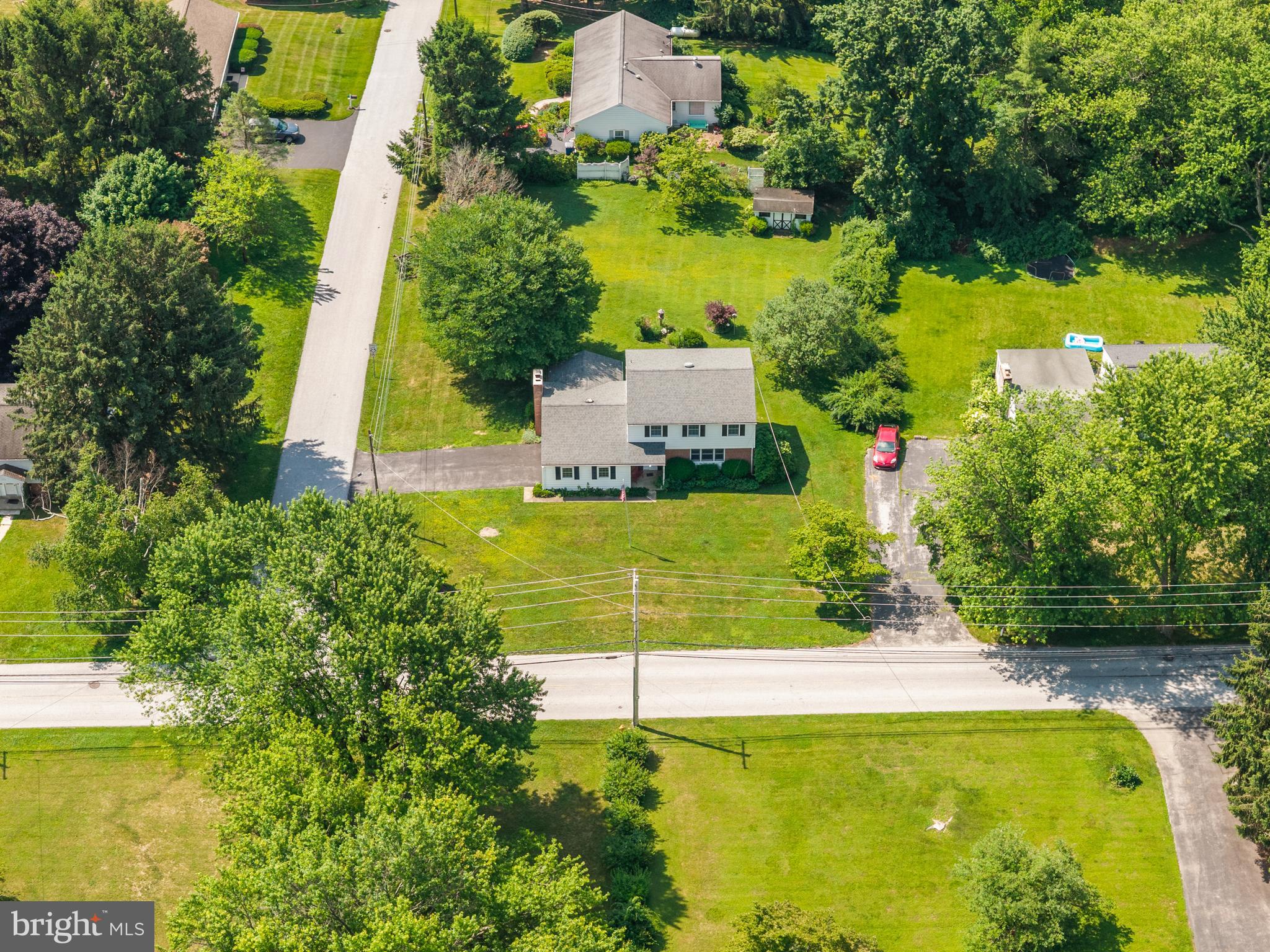 258 Monacy Road Coatesville, PA 19320 - Photo 47 of 54 an aerial view of a house with swimming pool patio and lake view