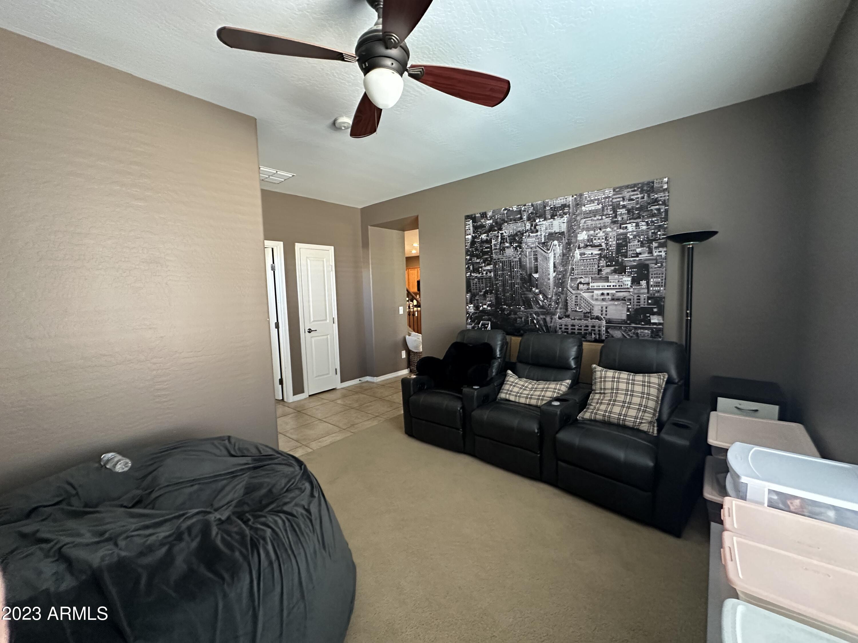 6864 West Ridgeline Road Peoria, AZ 85383 - Photo 15 of 44 5th bedroom downstairs sitting area