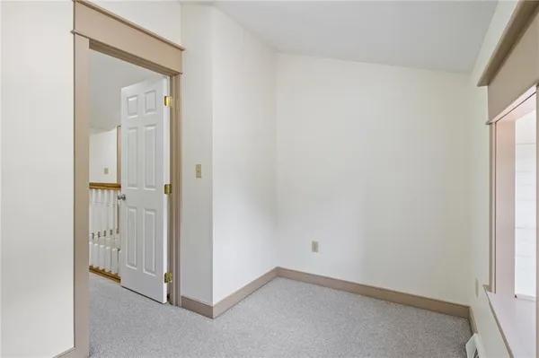 a balcony with a table and chairs