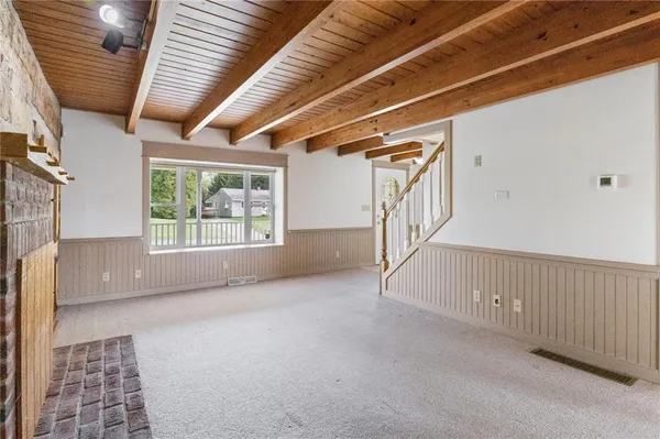 a view of an empty room with windows