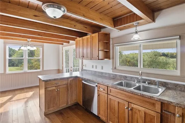 a kitchen with a sink and large window
