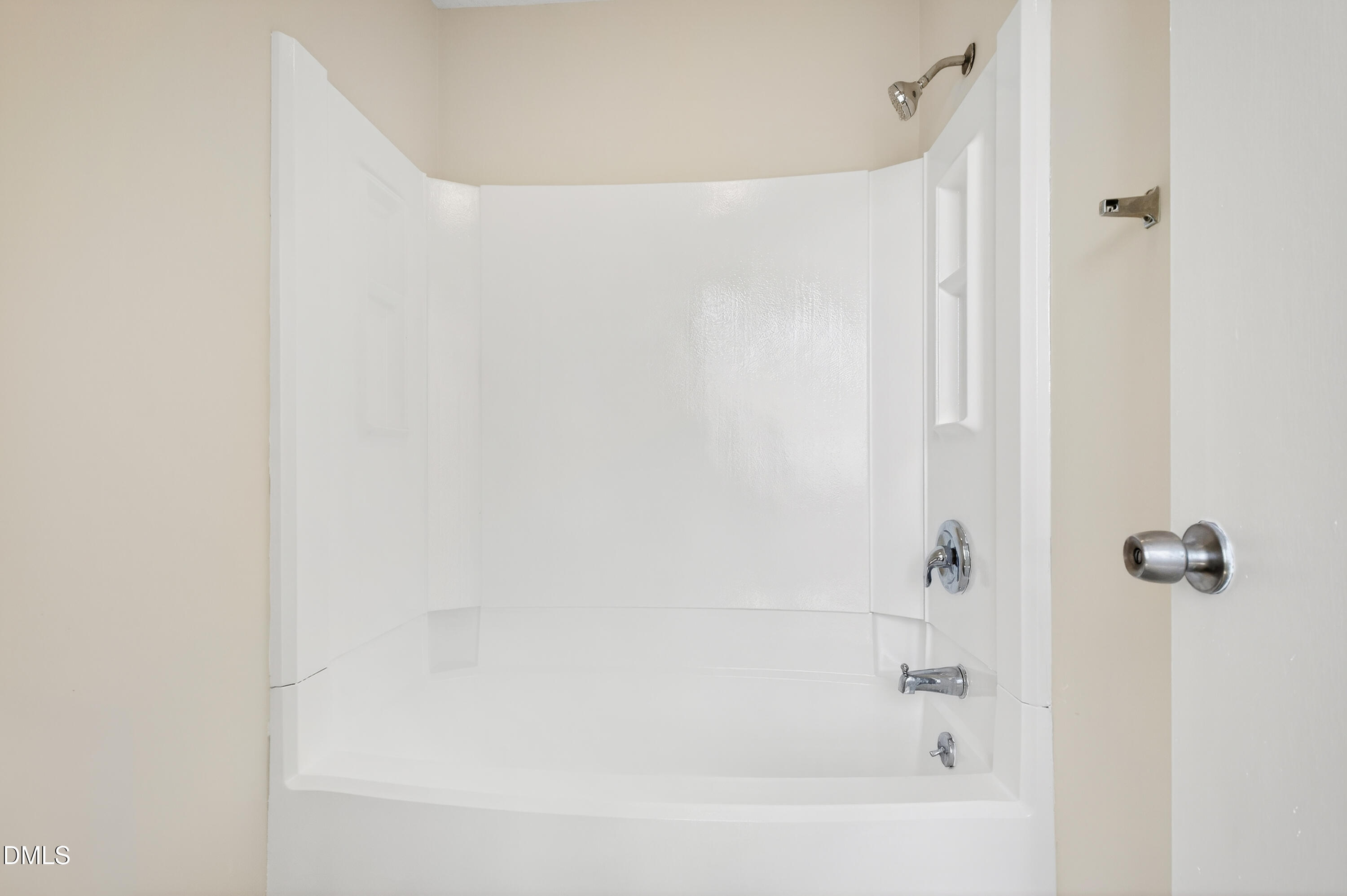 4921 Hollenden Drive, Unit 303 Raleigh, NC 27616 - Photo 22 of 33 a bathroom with a bathtub